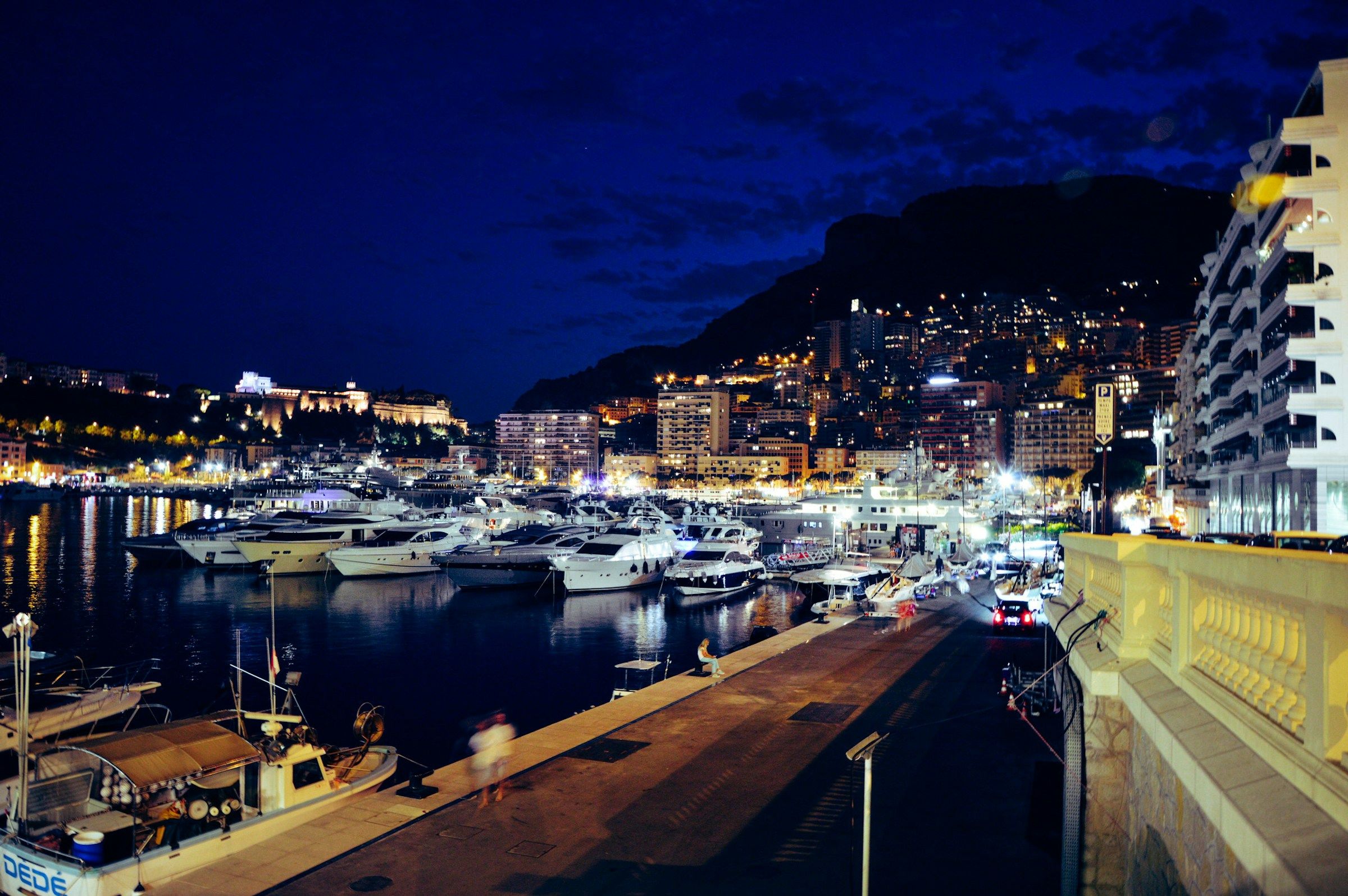 Monte-Carlo skyline at night with yachts